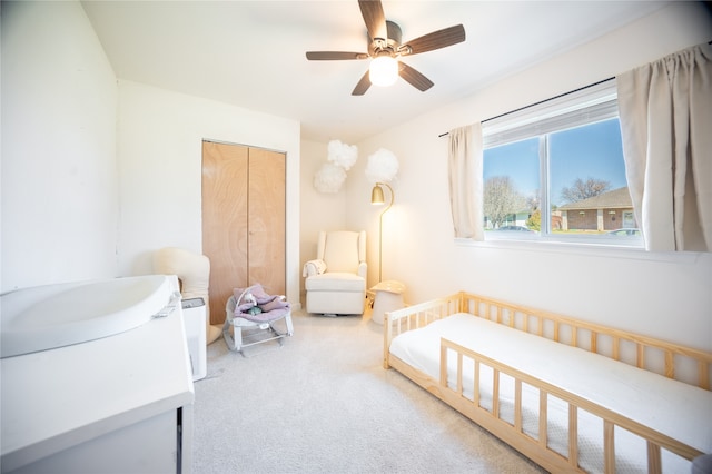 bedroom featuring a closet, carpet flooring, and ceiling fan