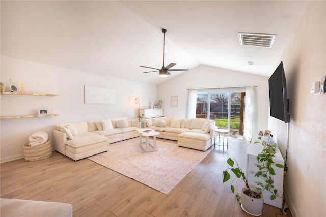 living area featuring visible vents, ceiling fan, light wood-type flooring, and lofted ceiling