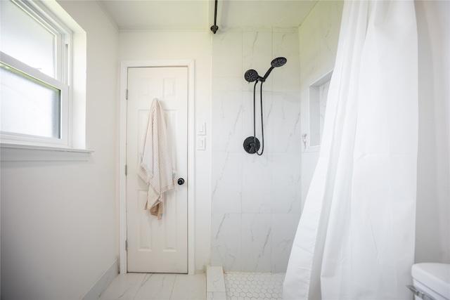 full bath featuring toilet, marble finish floor, and a marble finish shower