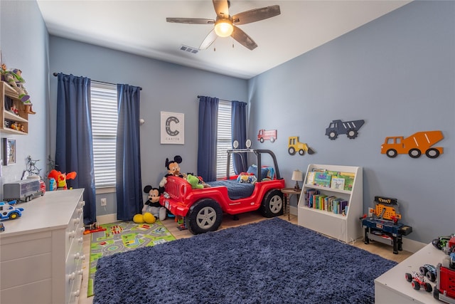 bedroom featuring visible vents and ceiling fan