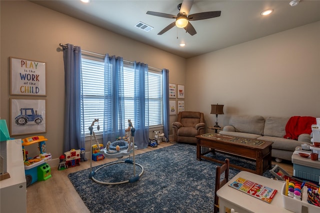 living room featuring visible vents, recessed lighting, a ceiling fan, and wood finished floors