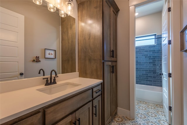 full bathroom featuring vanity,  shower combination, and baseboards