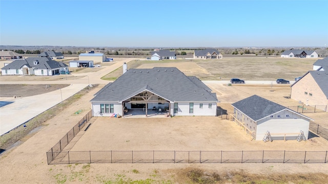 birds eye view of property with a residential view