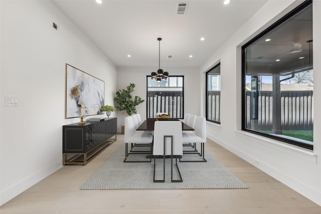 dining area featuring a notable chandelier, visible vents, recessed lighting, and light wood finished floors