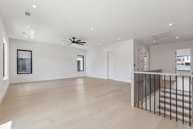 unfurnished room featuring attic access, recessed lighting, visible vents, and light wood finished floors