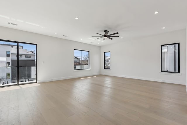 unfurnished room with visible vents, baseboards, ceiling fan, recessed lighting, and light wood-style flooring