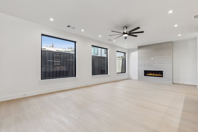 unfurnished living room with light wood finished floors, visible vents, recessed lighting, and a ceiling fan