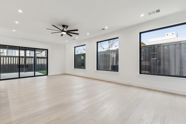 unfurnished living room with visible vents, baseboards, ceiling fan, recessed lighting, and light wood-style floors