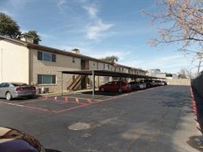 view of partially covered parking lot