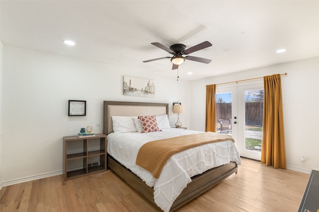 bedroom with access to outside, light wood-style floors, and baseboards