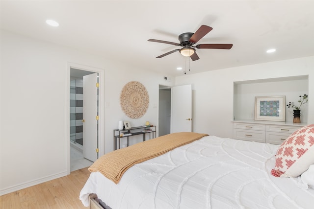 bedroom featuring light wood-style flooring, recessed lighting, and baseboards