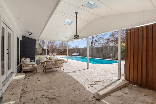 view of pool featuring a patio area, a fenced in pool, a fenced backyard, and ceiling fan