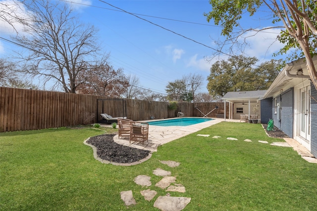 view of yard with a fenced in pool, a fenced backyard, a ceiling fan, and a patio area