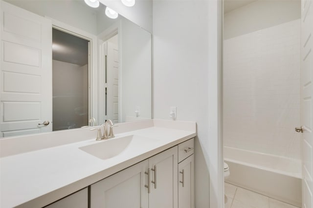 full bathroom with tile patterned flooring, washtub / shower combination, toilet, and vanity