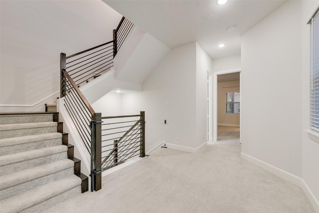 stairway with recessed lighting, carpet, and baseboards