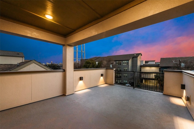 patio terrace at dusk with a balcony