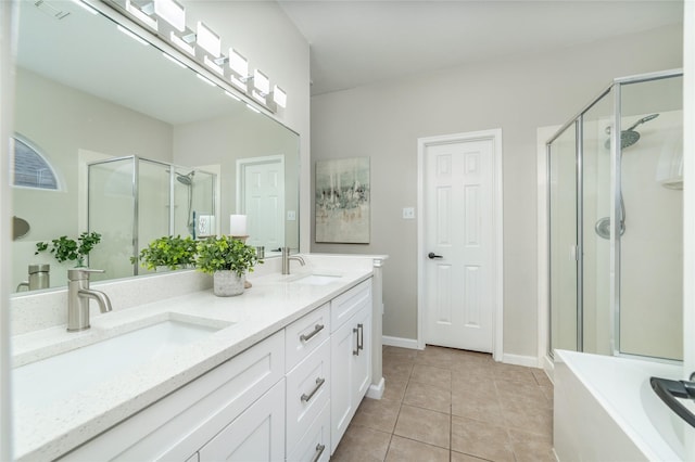 full bath with tile patterned flooring, a shower stall, double vanity, and a sink