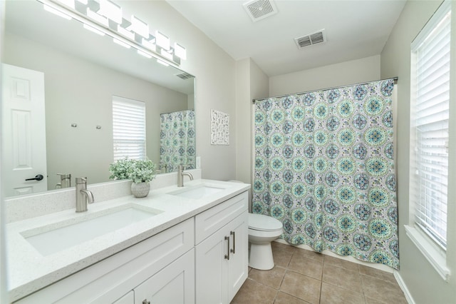 full bath featuring tile patterned floors, visible vents, and a sink