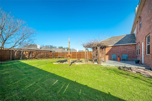 view of yard with a fenced backyard and a patio