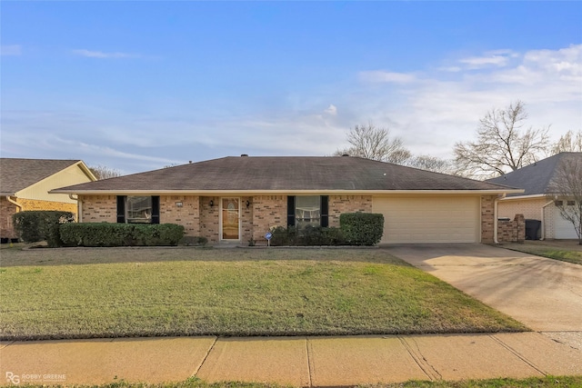 ranch-style home featuring brick siding, a shingled roof, concrete driveway, a front yard, and an attached garage