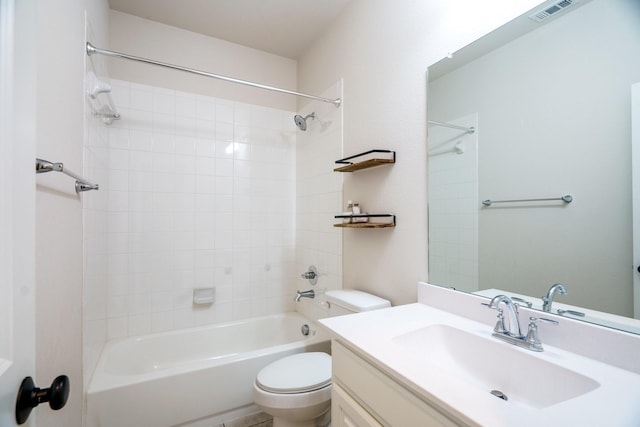 bathroom featuring visible vents, vanity, toilet, and bathing tub / shower combination