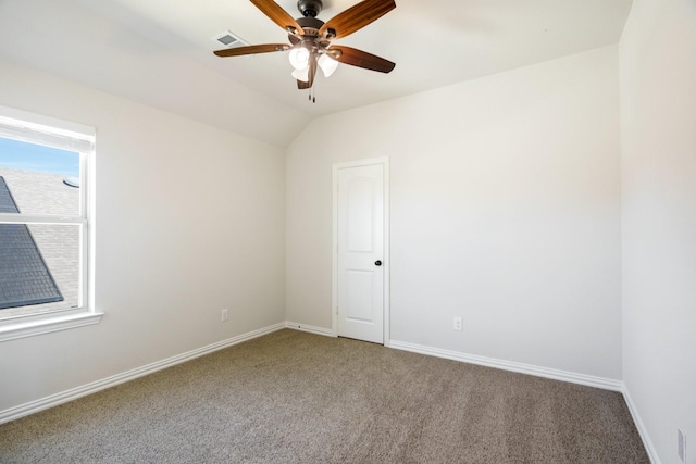 spare room featuring visible vents, baseboards, ceiling fan, and carpet floors