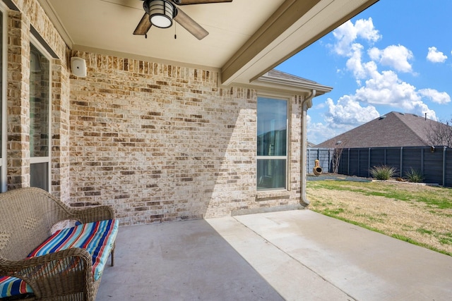 view of patio / terrace featuring a ceiling fan and fence