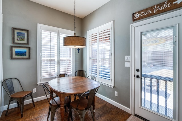 dining room with baseboards and dark wood-style floors