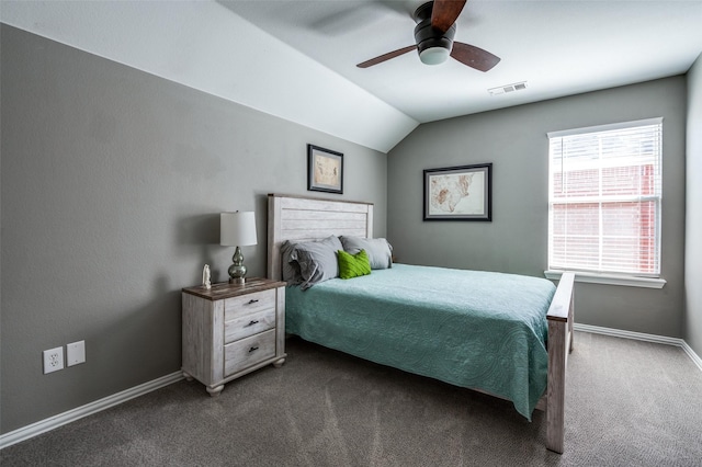 bedroom with visible vents, ceiling fan, baseboards, dark carpet, and vaulted ceiling