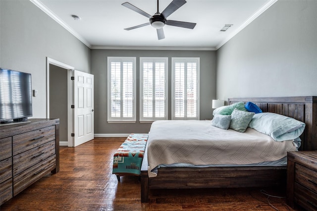 bedroom featuring visible vents, ornamental molding, a ceiling fan, wood finished floors, and baseboards