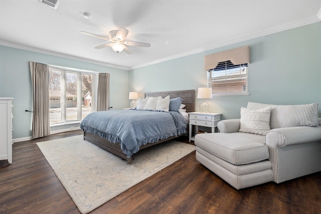 bedroom with visible vents, ornamental molding, a ceiling fan, wood finished floors, and baseboards