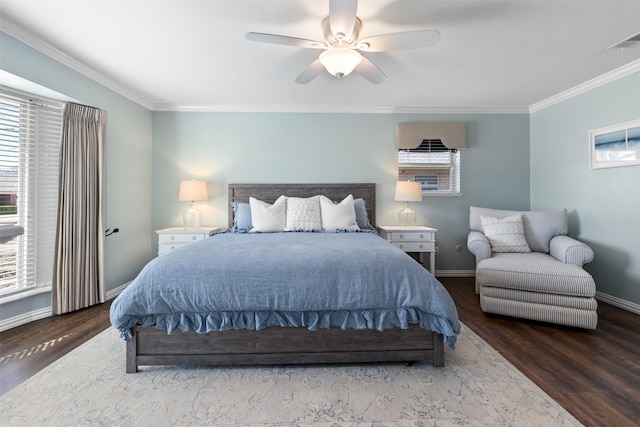 bedroom featuring baseboards, wood finished floors, visible vents, and ornamental molding