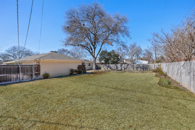 view of yard featuring a fenced backyard