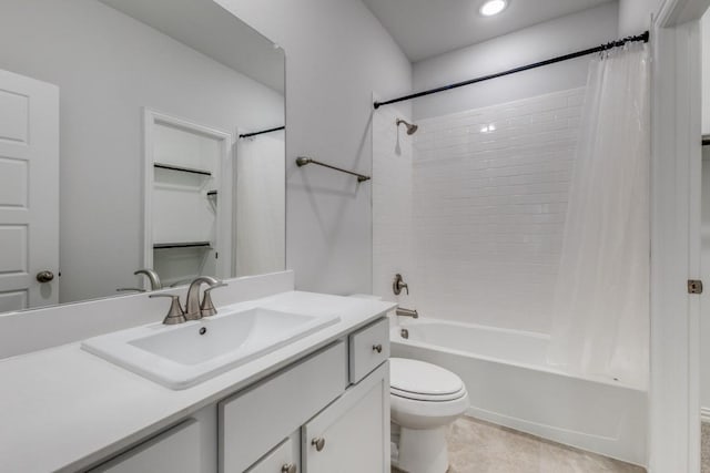 full bath with toilet, shower / bath combo with shower curtain, and vanity