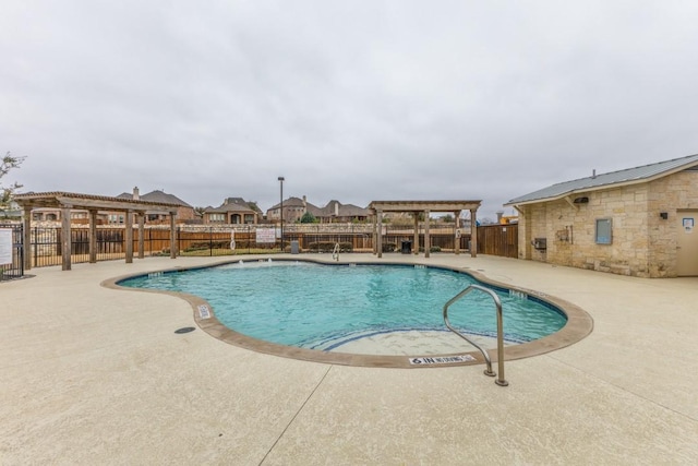 pool with a patio area, fence private yard, and a pergola