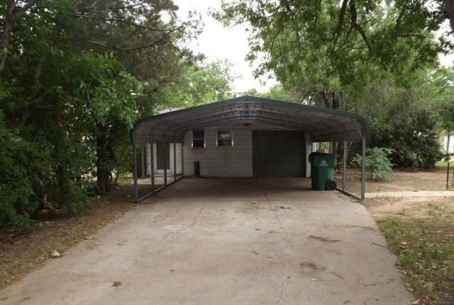 view of parking / parking lot with a garage