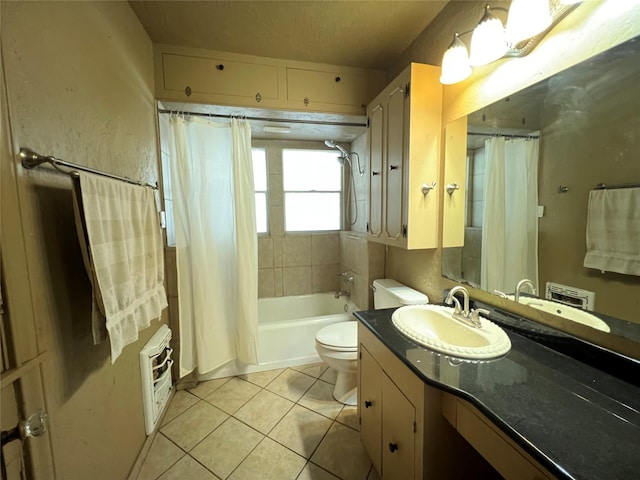 bathroom featuring heating unit, toilet, tile patterned floors, shower / bath combination with curtain, and vanity