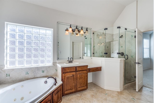 full bathroom with vanity, a shower stall, vaulted ceiling, tile patterned floors, and a jetted tub