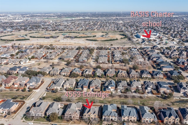 birds eye view of property with a residential view