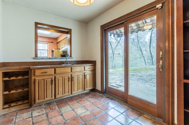 interior space with a sink and a textured ceiling