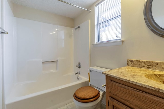 bathroom featuring shower / bathing tub combination, a textured ceiling, vanity, and toilet