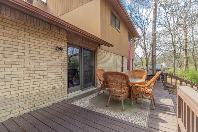 wooden deck featuring outdoor dining space