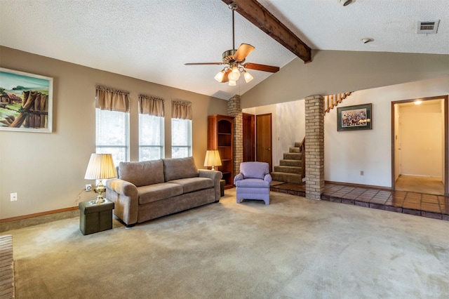 living room featuring visible vents, a textured ceiling, lofted ceiling with beams, and carpet