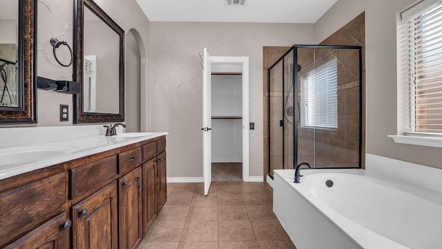 full bathroom featuring tile patterned flooring, a garden tub, visible vents, and a stall shower