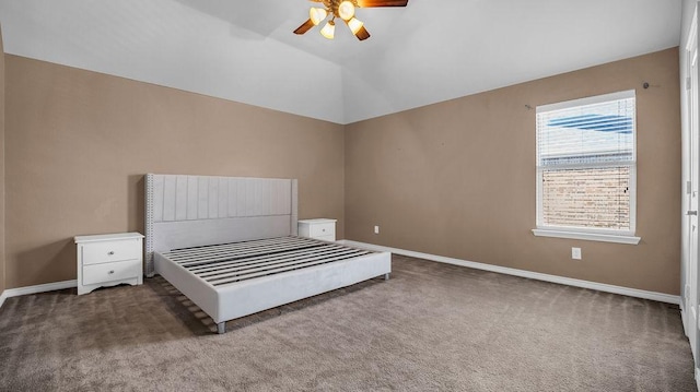 unfurnished bedroom featuring a ceiling fan, vaulted ceiling, carpet, and baseboards