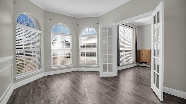 unfurnished dining area with wood finished floors, baseboards, french doors, and ornamental molding