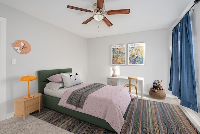 bedroom featuring baseboards, carpet, and ceiling fan