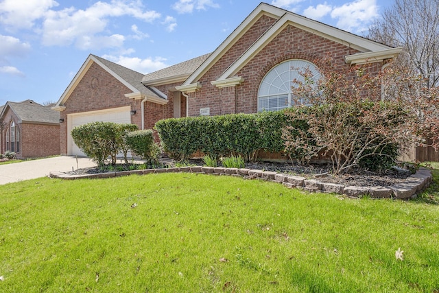 single story home featuring a garage, driveway, brick siding, and a front yard