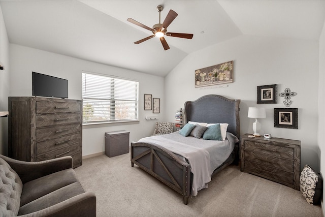 bedroom with light carpet, baseboards, a ceiling fan, and lofted ceiling