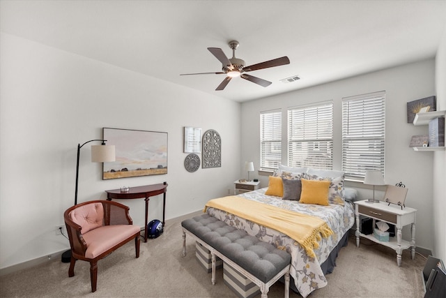 bedroom with visible vents, ceiling fan, baseboards, and carpet